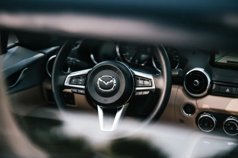 Buttons, Not Bytes: The Case for Keeping Human Hands in Control of the Grand Tourer